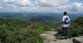 Student on top of mountain