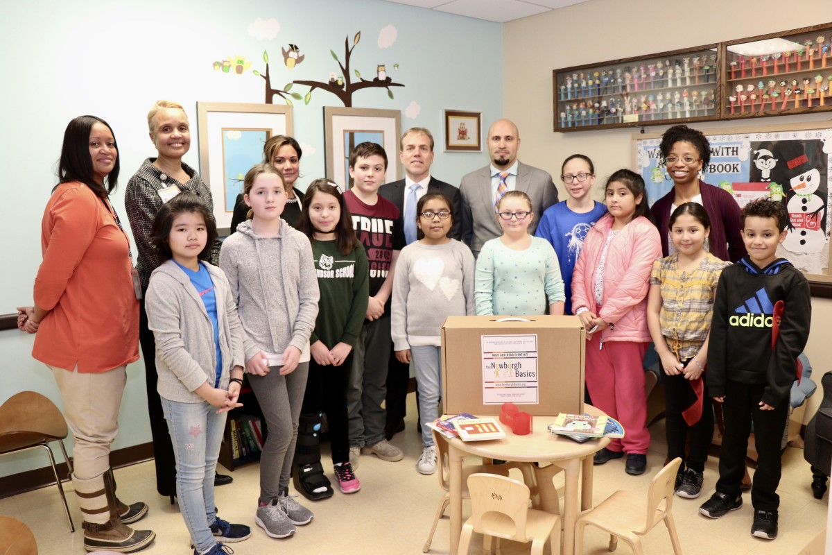 Group poses with Dr. Padilla and members of Cornerstone Family Health