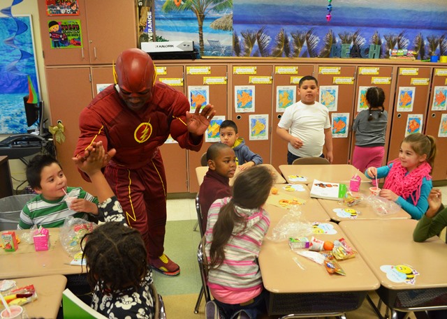 The Flash greeting students in the classroom