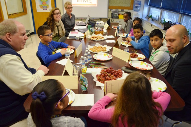 Students eat lunch and discuss their thoughts with the Superintendent