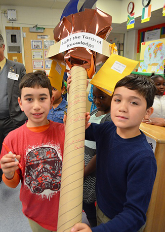 Students holding the torch of knowledge