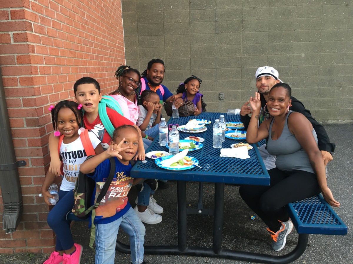 Parents and students at the picnic tables.