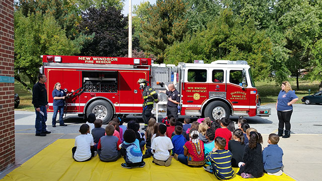 Students infront of a fire engine