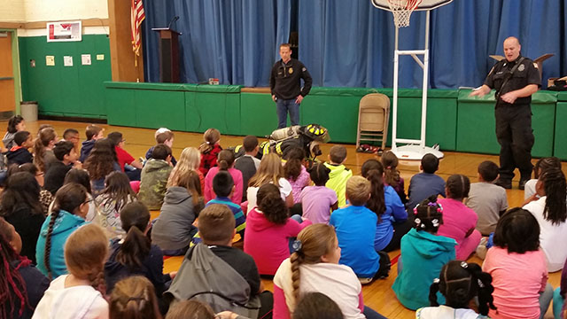 Inside the school at the fire safety assembly