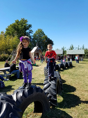 Students playing on the farms playground