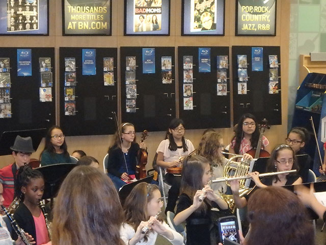 Student performing with their musical instruments