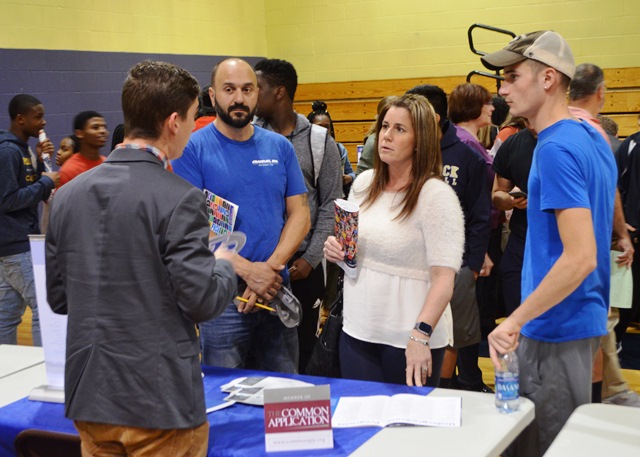 Students in the College and Career Fair talking to representatives 1