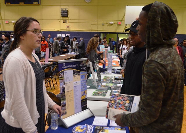 Students in the College and Career Fair talking to representatives 5