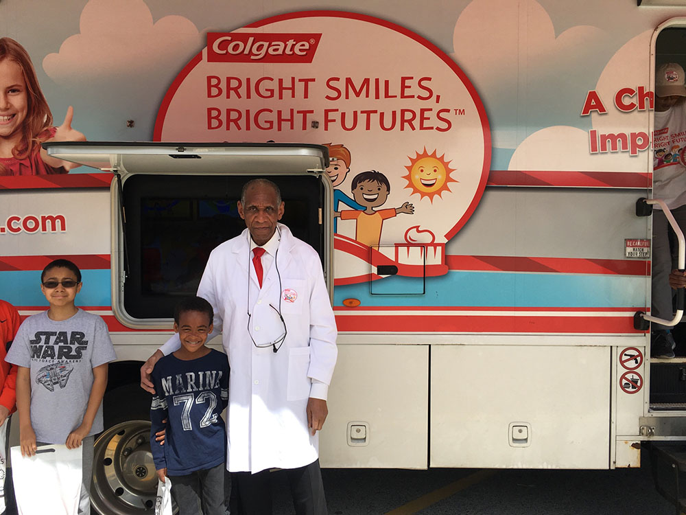 A student and dentist outside the van.