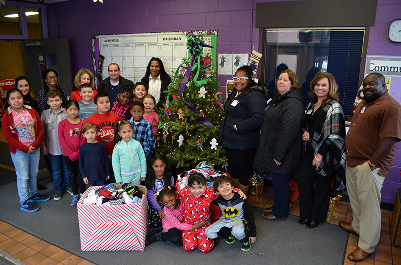 Vails Gate Students and Faculty stand next to sock donation