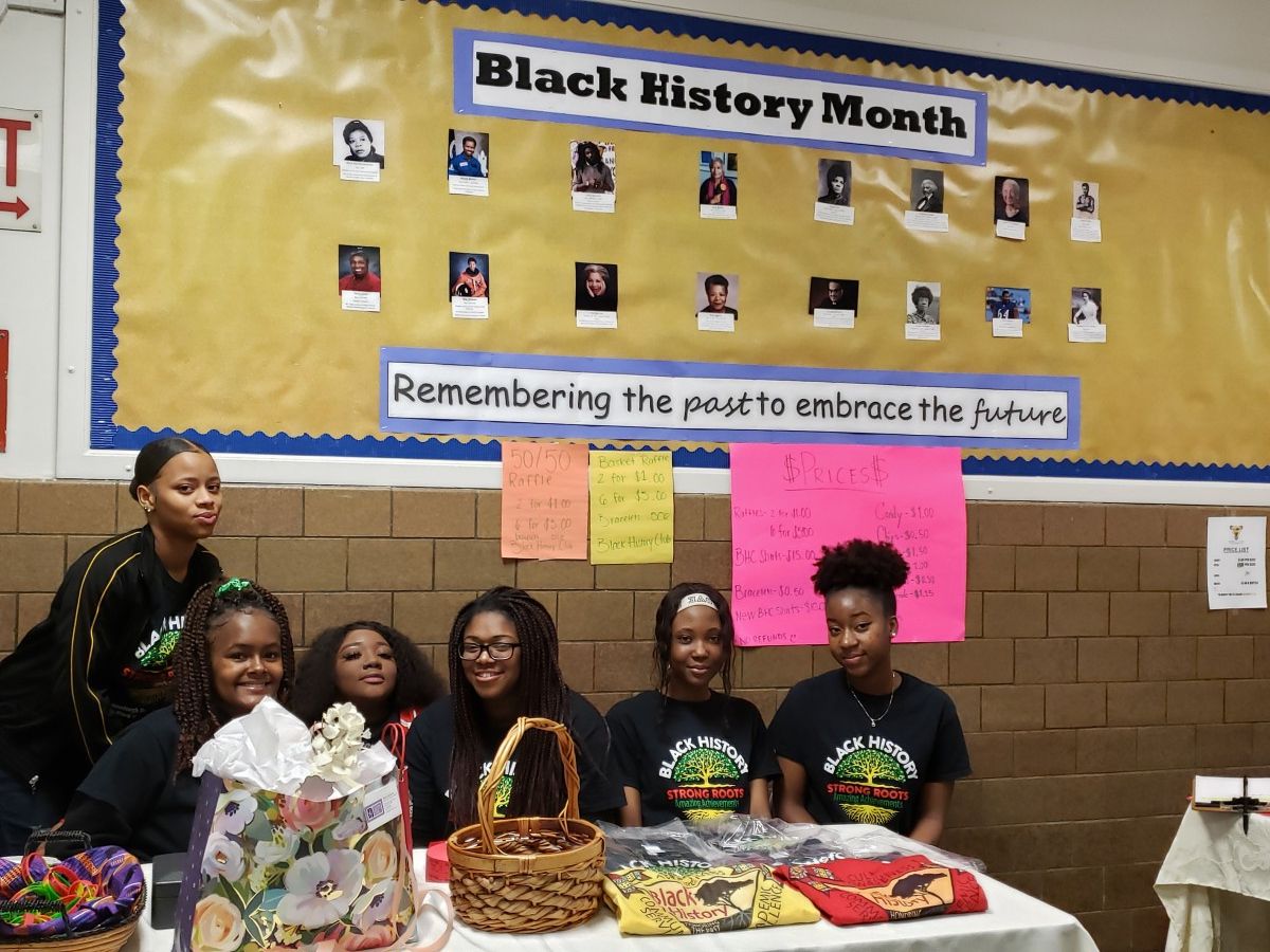 Members of the NFA Black History Club pose for a photo at the check-in table.