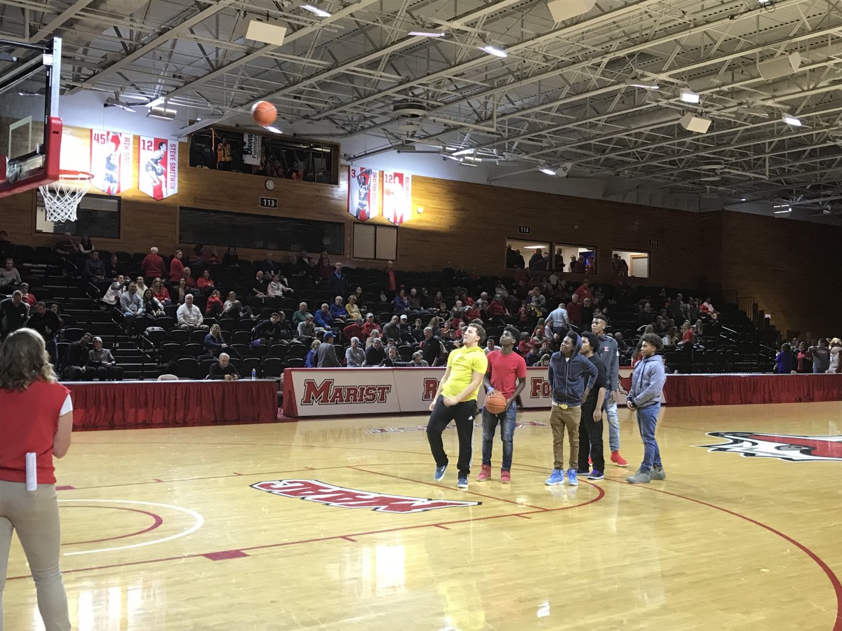 Students play game on court at halftime